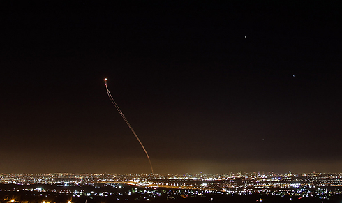 Iron Dome intercepting a rocket over the lights of central Israel. (Photo: Anders Koenig)