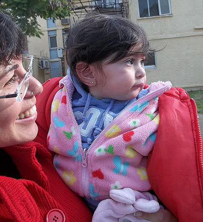 Meital Trebalsi with her one-year-old daughter. 'We want to raise our children in Sderot' (Photo